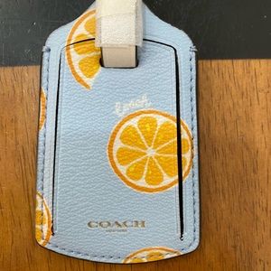 Coach orange and blue luggage tag